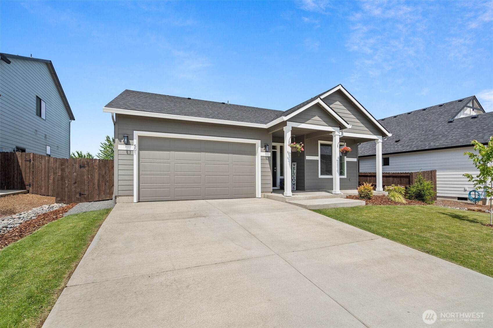 501 Pagget Avenue Winlock, WA 98596 - Photo 2 of 30 a front view of a house with a yard and garage