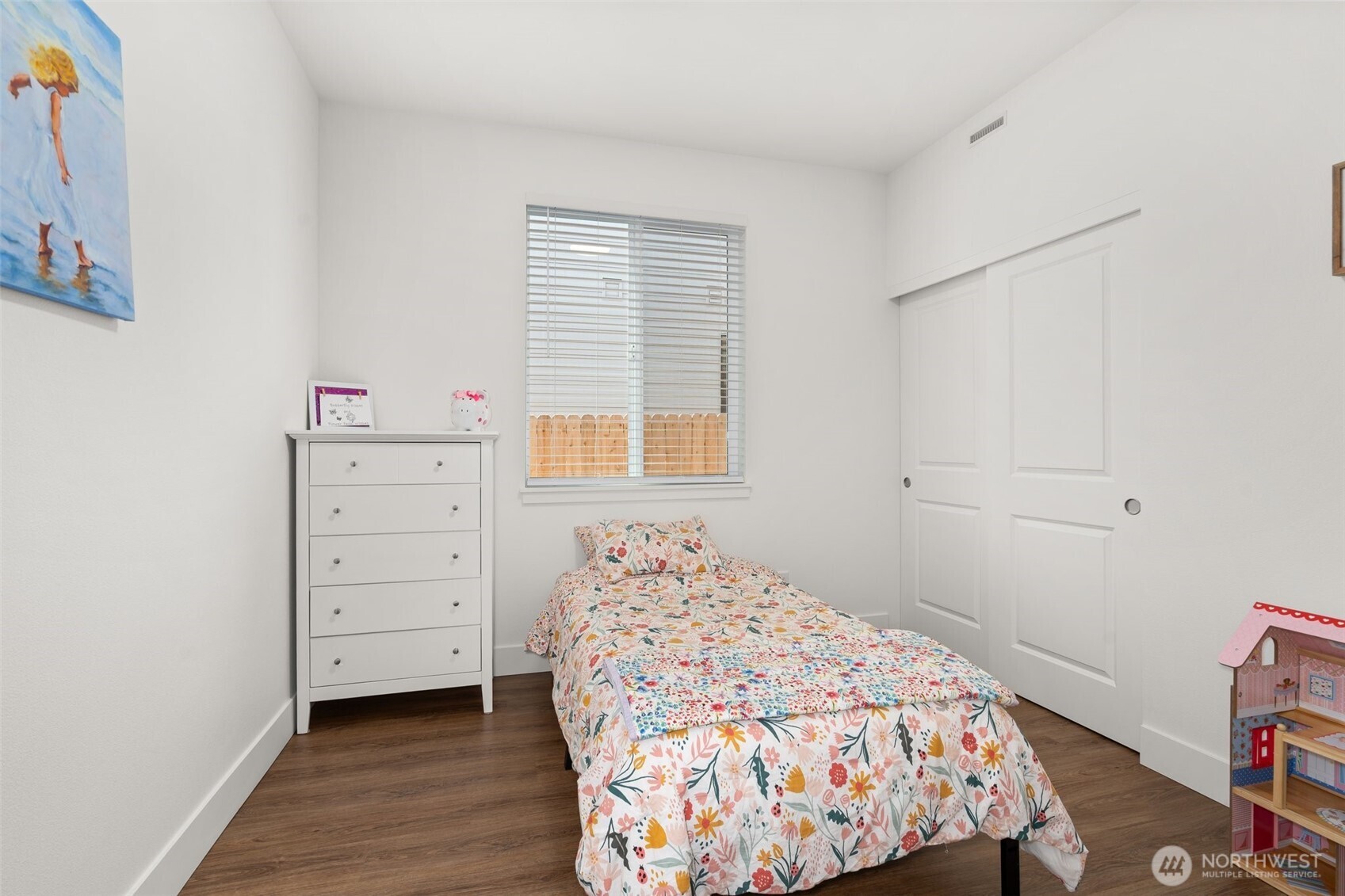 501 Pagget Avenue Winlock, WA 98596 - Photo 23 of 30 a bedroom with a bed and wooden floor