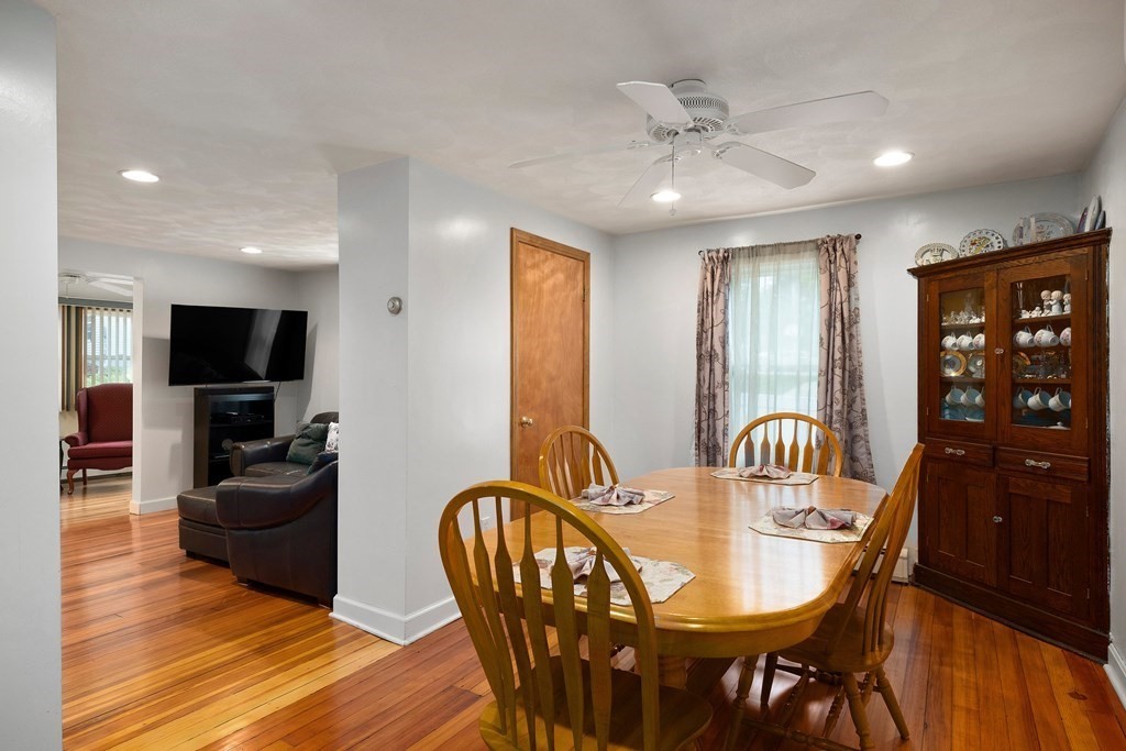102 Orange Street Reading, MA 01867 - Photo 5 of 23 a view of a dining room with furniture window and wooden floor
