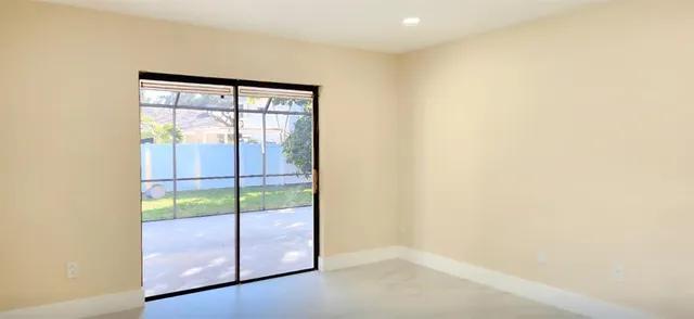 a view of a house with a yard and garage