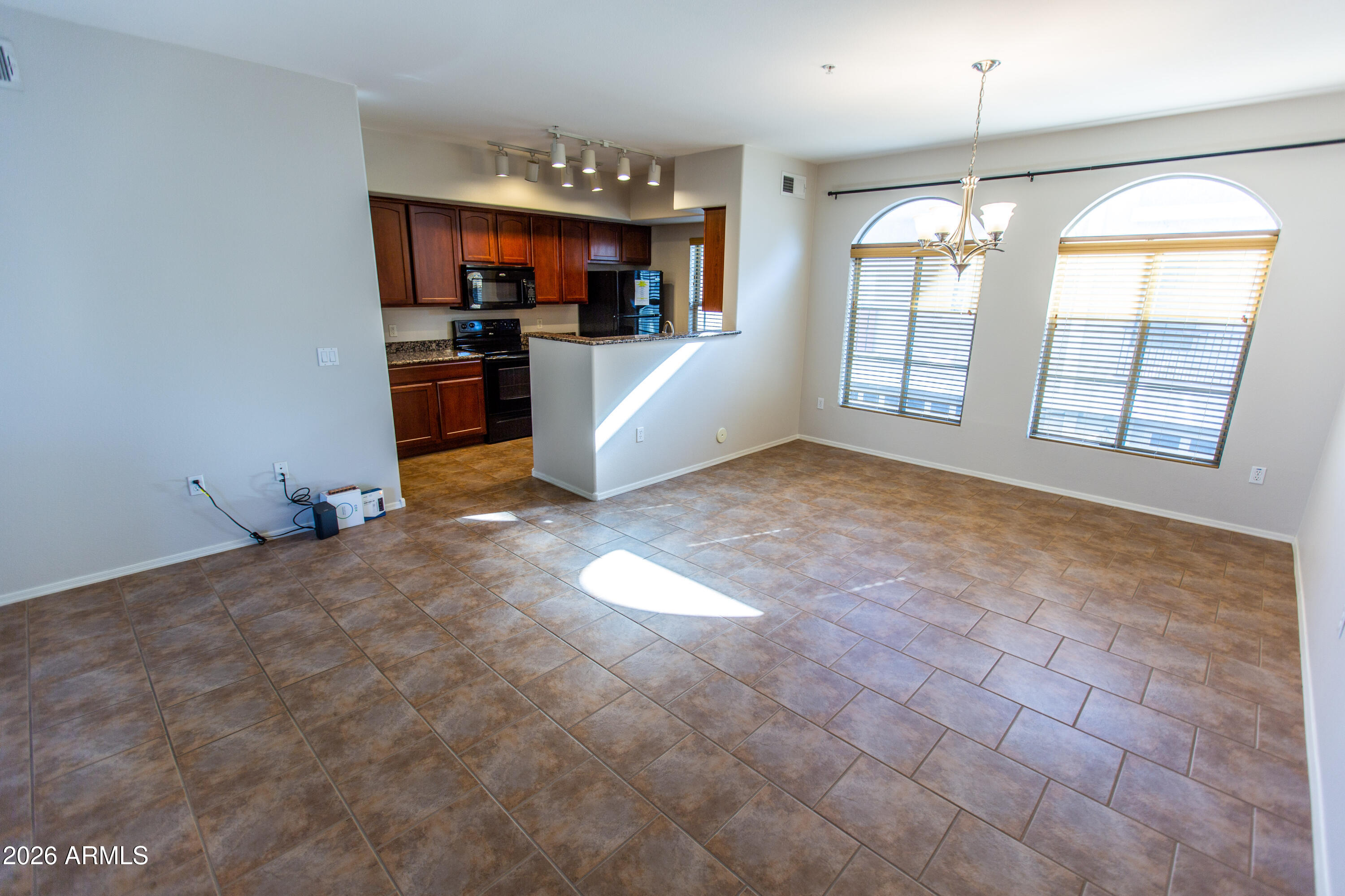 280 South Evergreen Road, Unit 1317 Tempe, AZ 85288 - Photo 15 of 33 a view of livingroom with hardwood floor and a ceiling fan