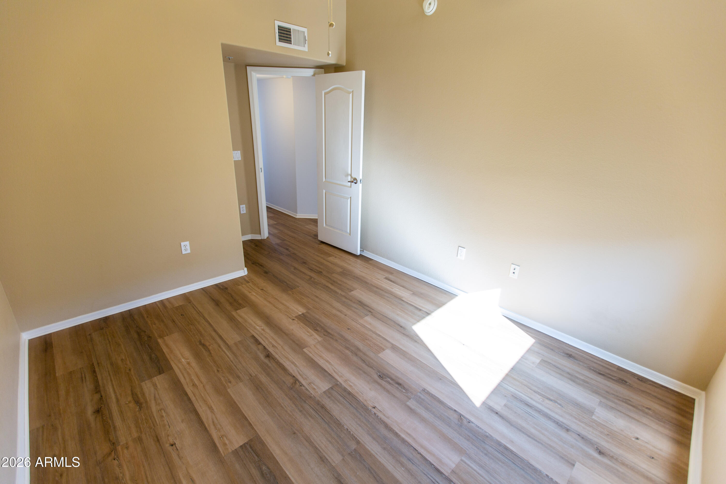 280 South Evergreen Road, Unit 1317 Tempe, AZ 85288 - Photo 3 of 33 a view of a room with wooden floor