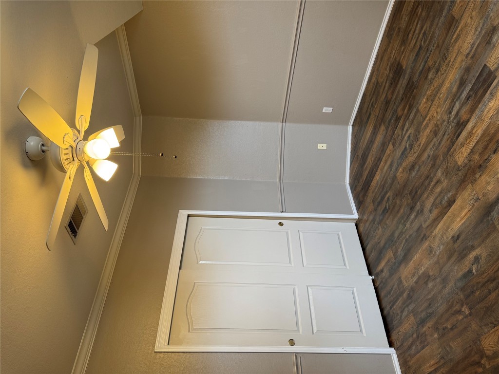 8724 Barrow Glen Loop Austin, TX 78749 - Photo 12 of 19 a view of a room with wooden floor