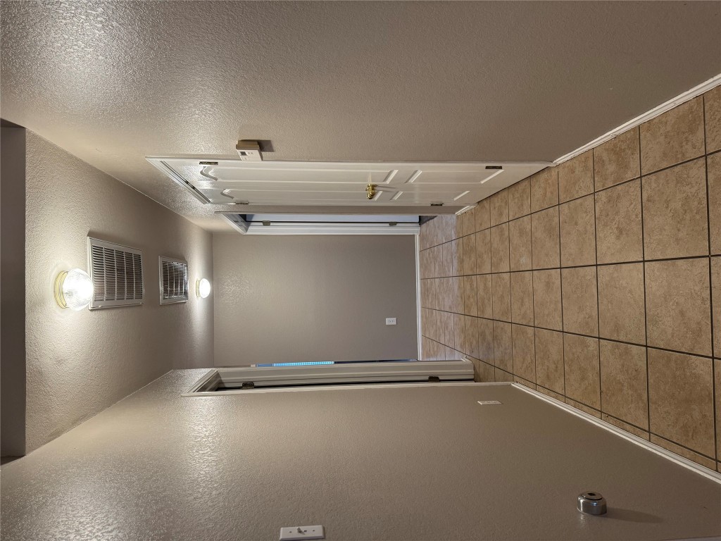 8724 Barrow Glen Loop Austin, TX 78749 - Photo 6 of 19 a view of hallway with stairs