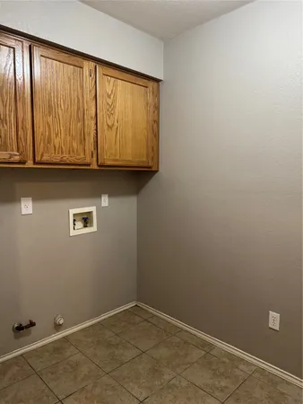 an empty room with wooden floor