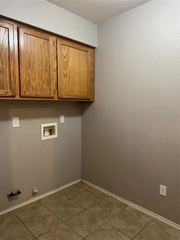 an empty room with wooden floor