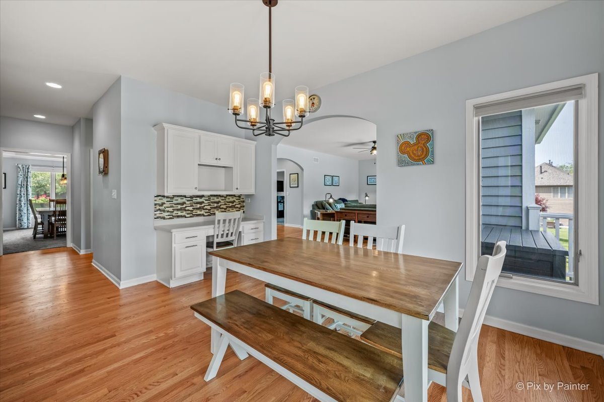 7104 Dove Way Cary, IL 60013 - Photo 18 of 82 a view of a dining room with furniture window and wooden floor