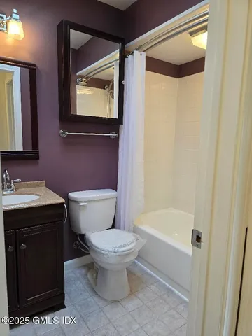 a bathroom with a toilet a sink and bathtub