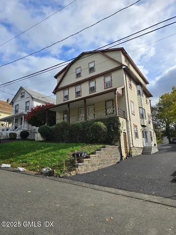 a view of a house with a street