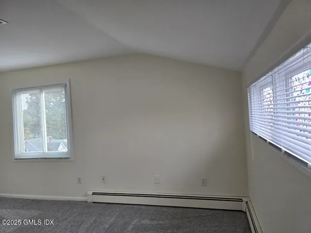 a view of a room that has a window