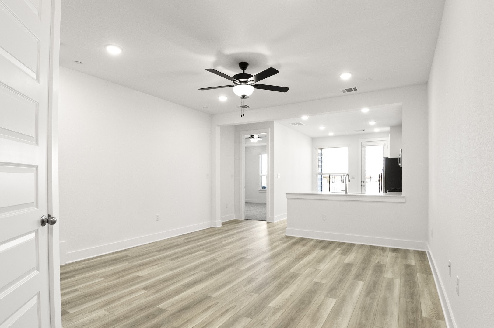 18909 Schultz Lane, Unit 1002 Round Rock, TX 78664 - Photo 5 of 24 Unfurnished room featuring recessed lighting, light wood finished floors, and ceiling fan