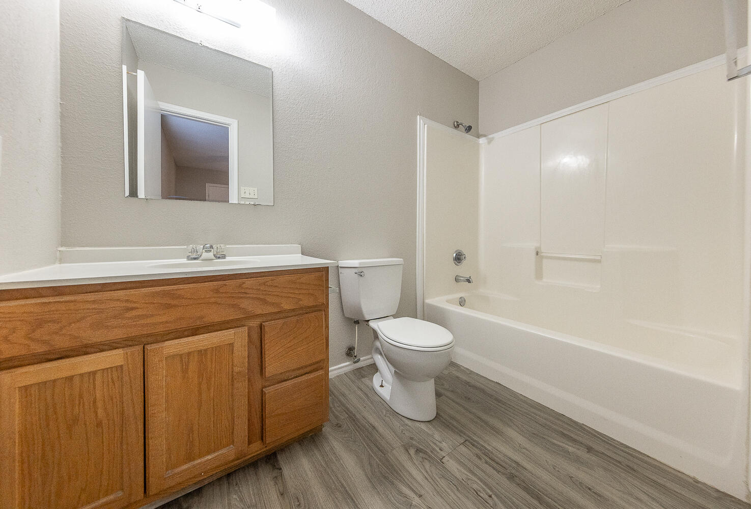 804 East 77th Street Lubbock, TX 79404 - Photo 11 of 15 a bathroom with a sink a toilet and shower