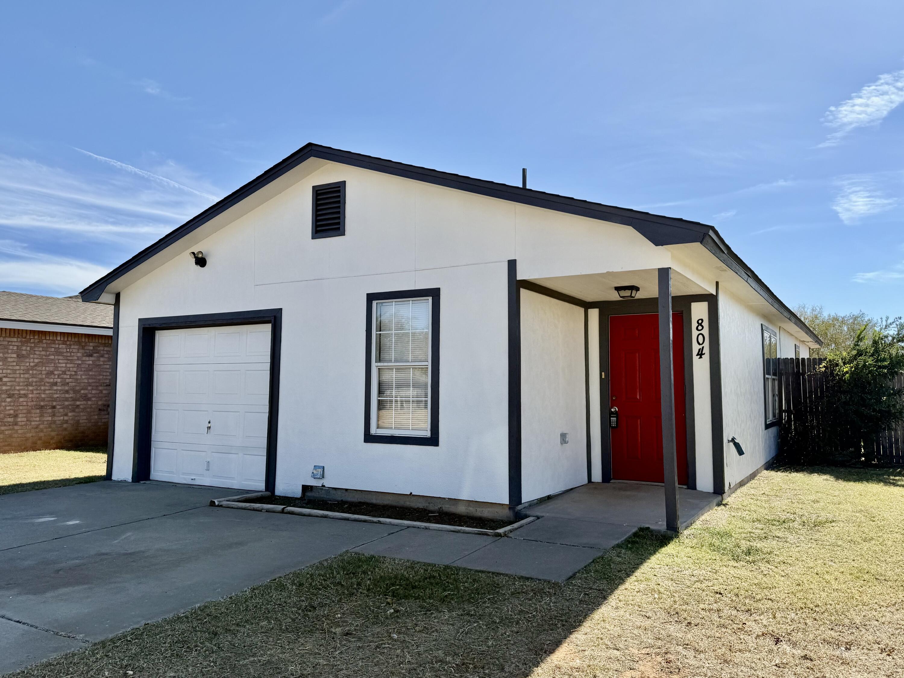 804 East 77th Street Lubbock, TX 79404 - Photo 15 of 15 a front view of a house with a yard