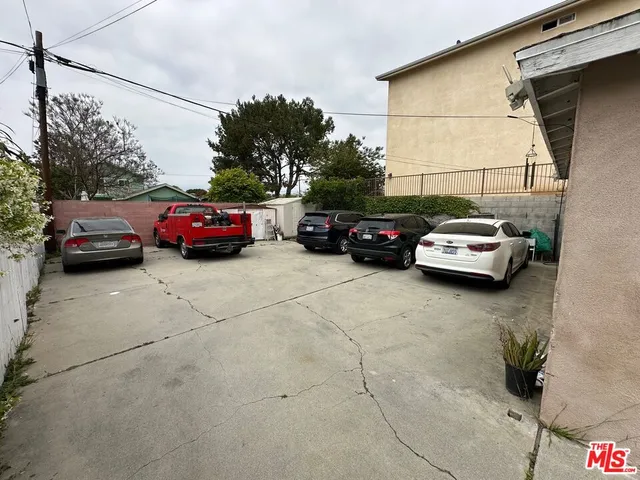 a couple of cars parked in parking area of a building