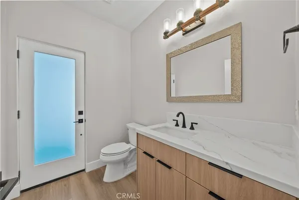 a bathroom with a sink a toilet and bathtub