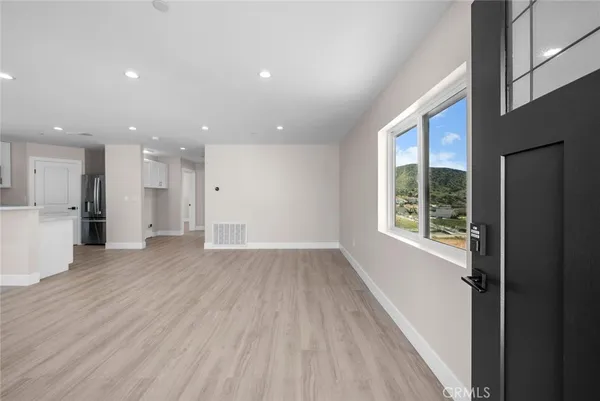 a view of kitchen with wooden floor and window
