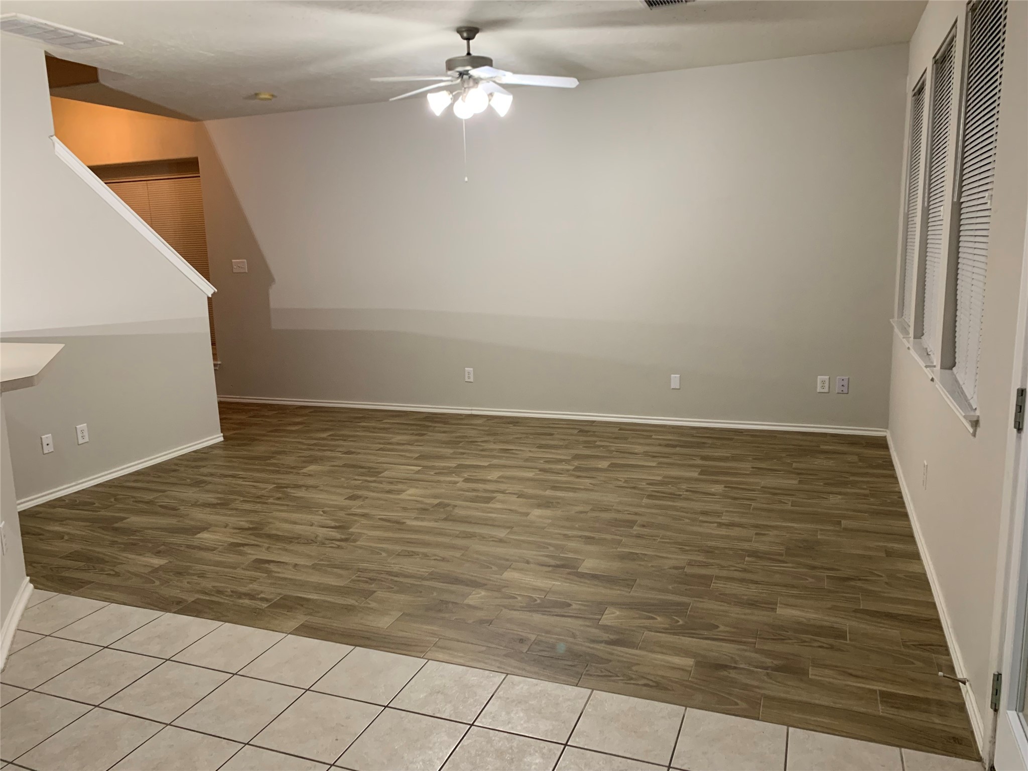 8904 Elm Drake Lane Humble, TX 77338 - Photo 7 of 22 Grey paint and wood tile flooring in living room