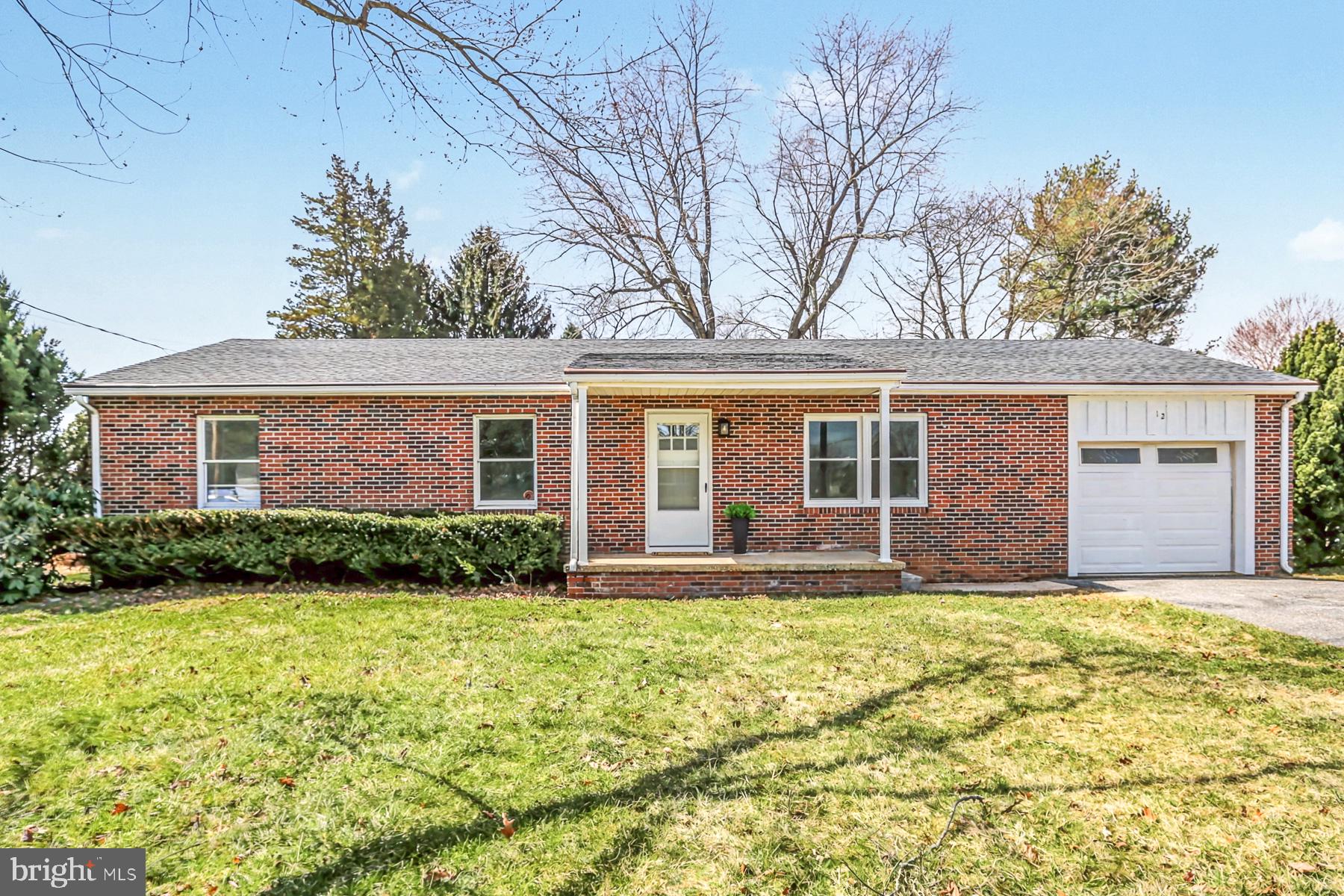 12 Locust Street Stewartstown, PA 17363 - Photo 1 of 23 front view of a house with yard