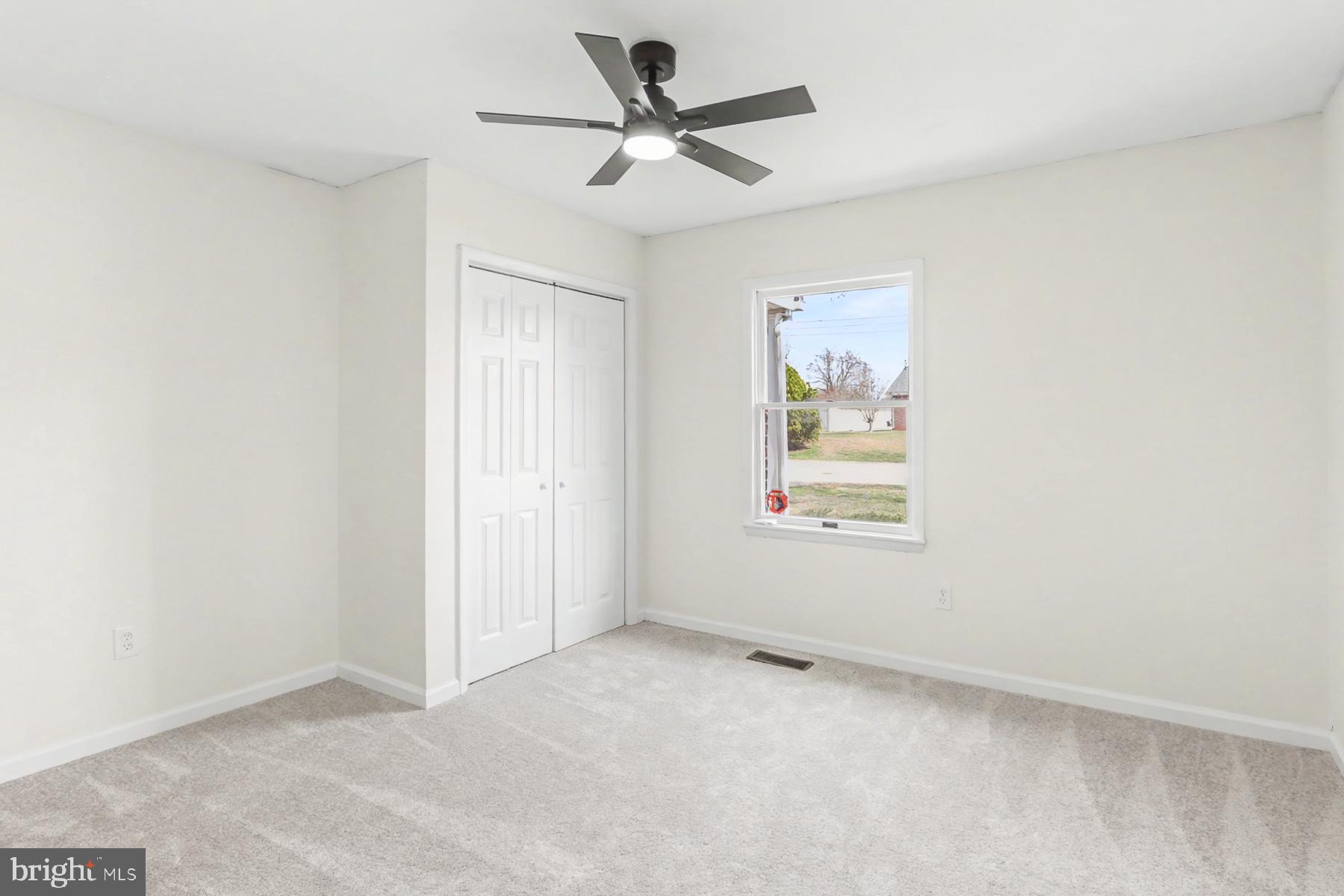 12 Locust Street Stewartstown, PA 17363 - Photo 16 of 23 an empty room with a window and a ceiling fan