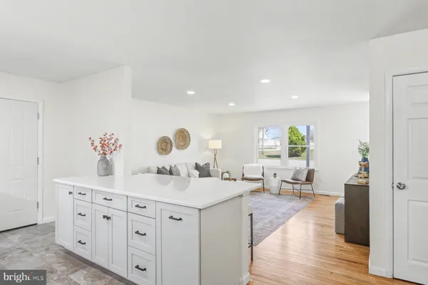 a spacious bathroom with double vanity sinks a vanity and a mirror