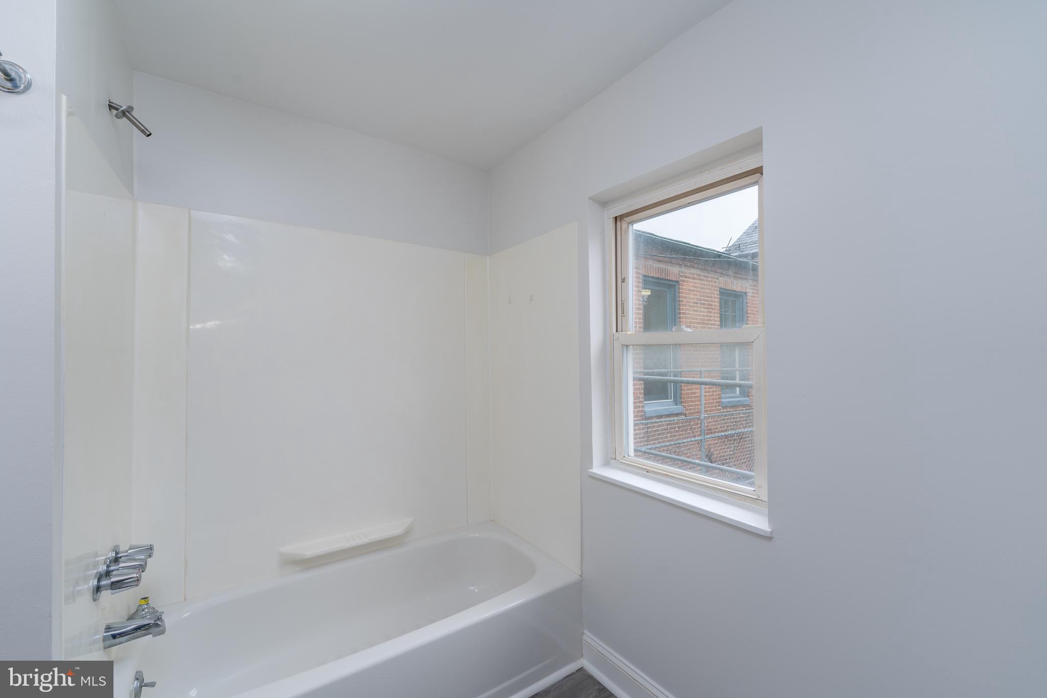 1722 Eastern Avenue, Unit 3 Baltimore, MD 21231 - Photo 11 of 13 a bathroom with a bathtub