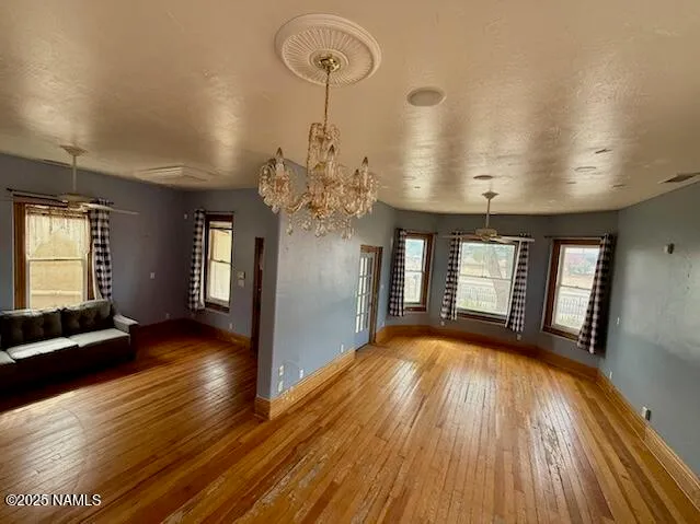 a view of a room with wooden floor and staircase