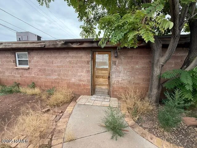 a brick building with a yard