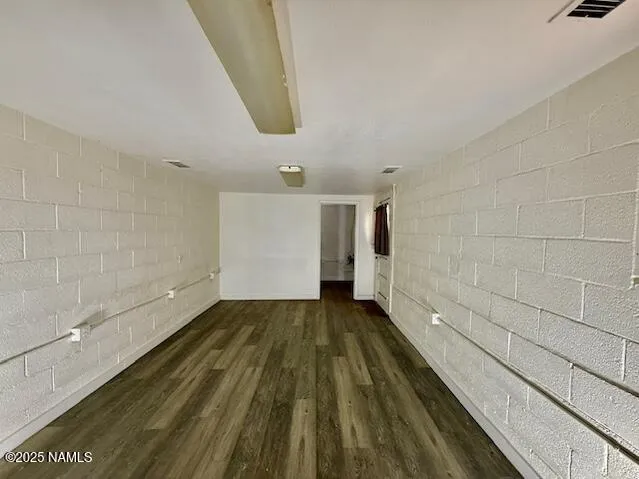 a view of an empty room and a window