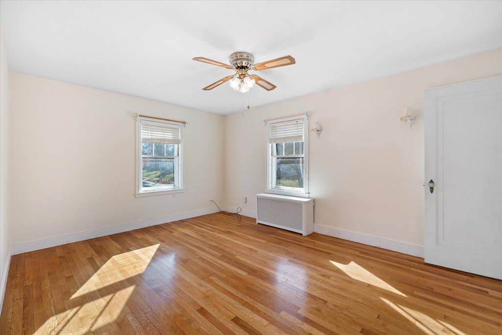 284 Beverly Road Worcester, MA 01605 - Photo 17 of 30 a bedroom with a bed and a window