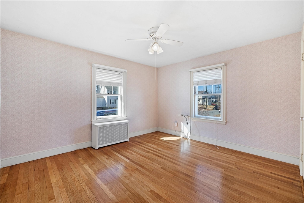 284 Beverly Road Worcester, MA 01605 - Photo 21 of 30 a view of an empty room with wooden floor and a window
