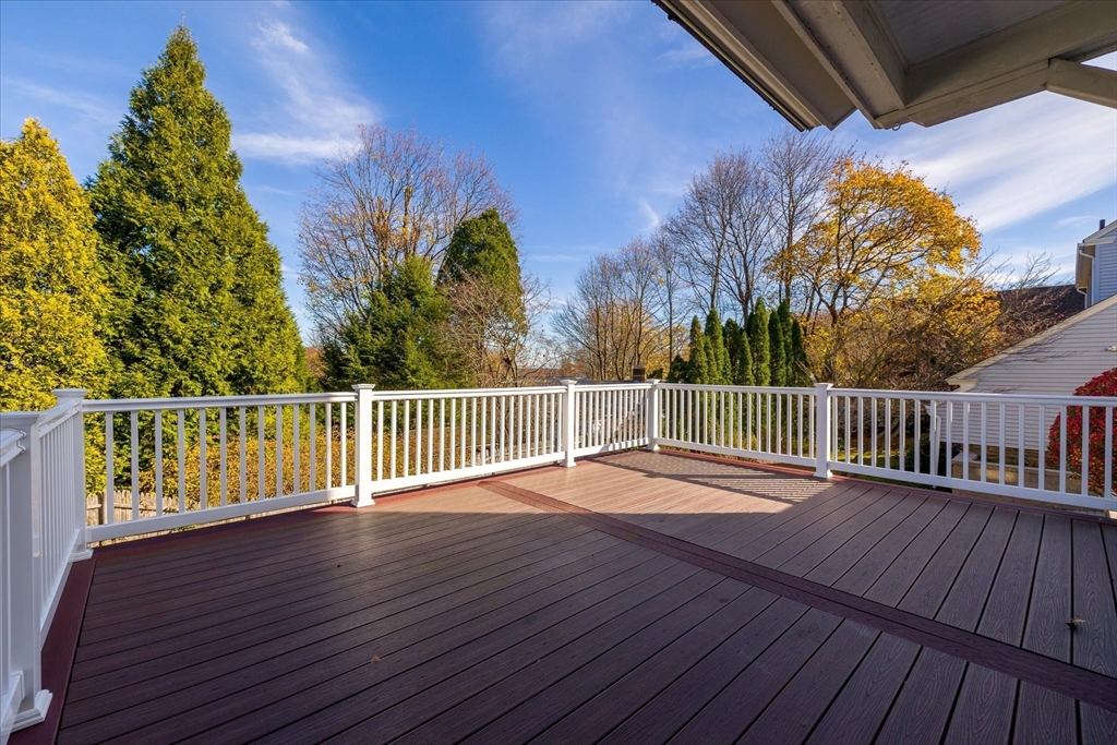 284 Beverly Road Worcester, MA 01605 - Photo 29 of 30 a balcony with hardwood floor and trees in the back