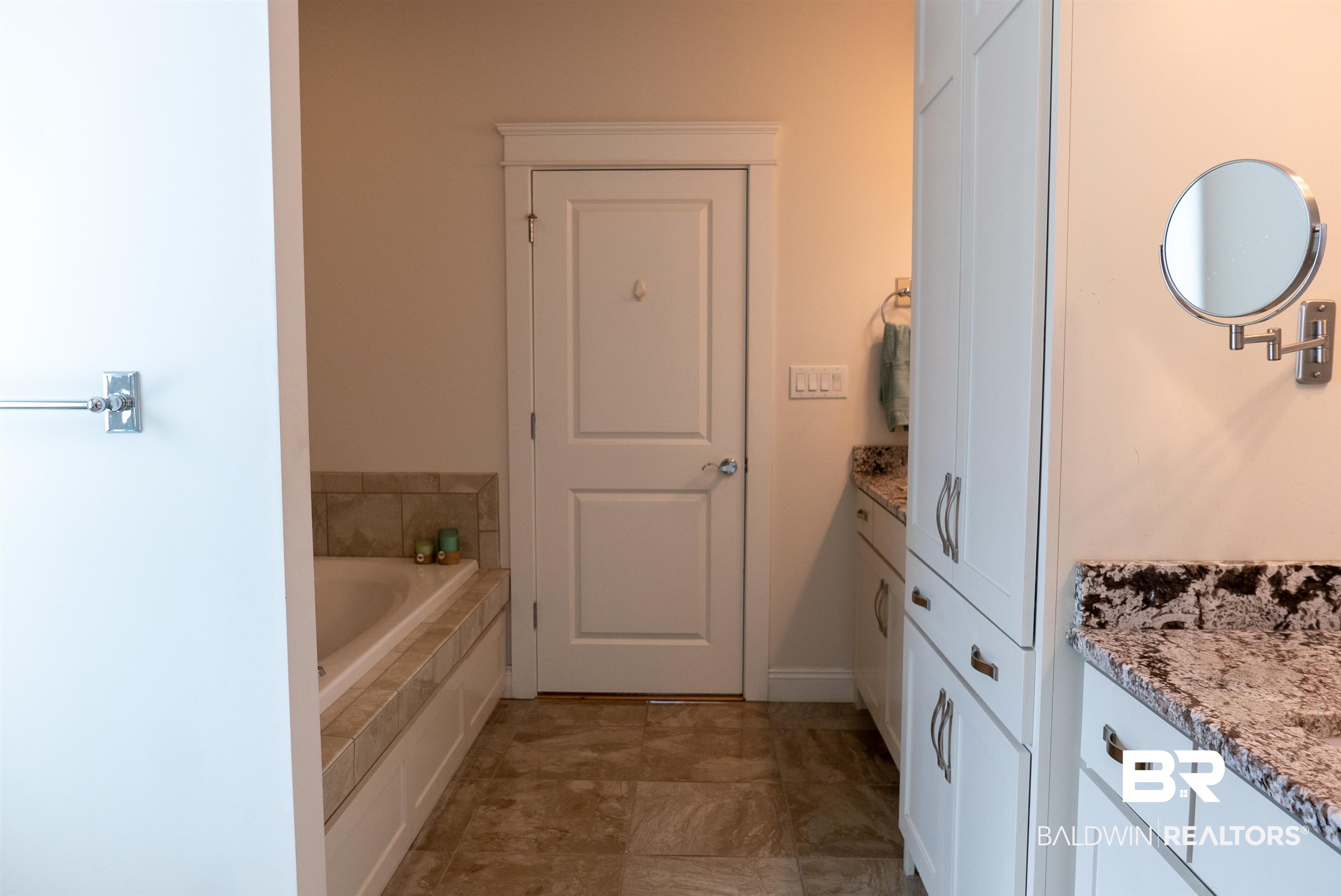 6684 Garrison Drive Daphne, AL 36527 - Photo 12 of 35 Bathroom featuring vanity and a relaxing tiled tub