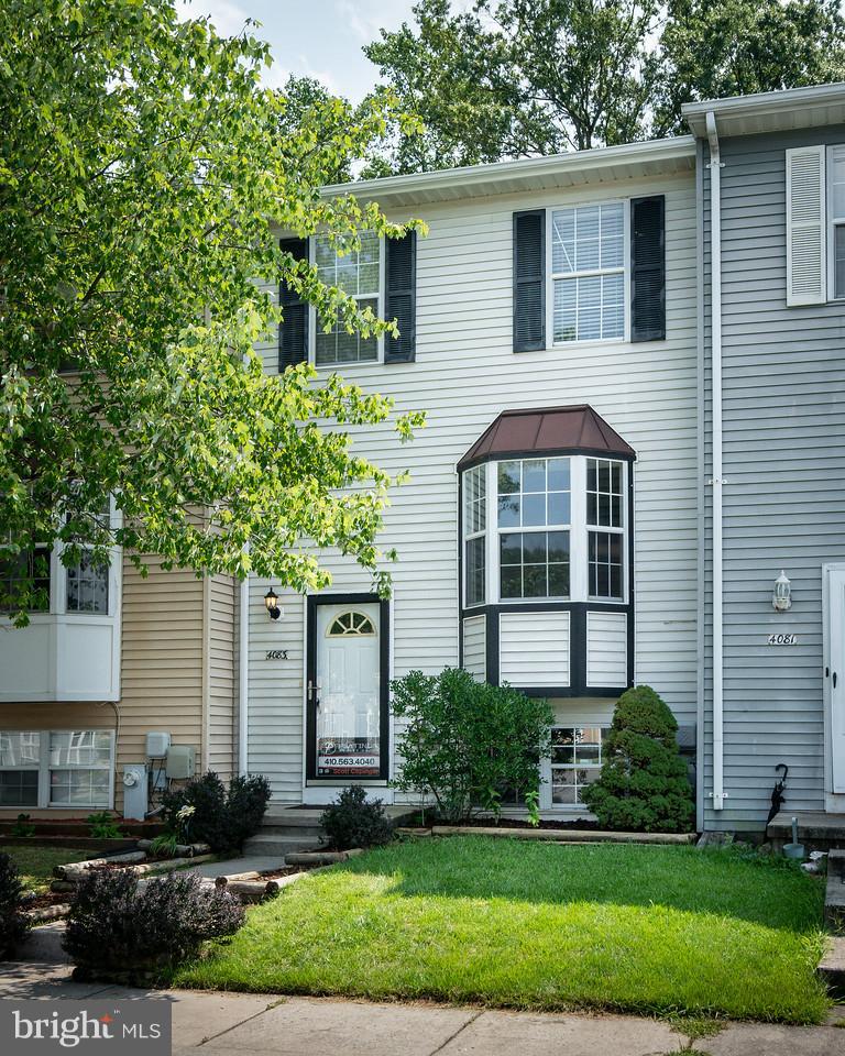 4083 Rustico Road Baltimore, MD 21220 - Photo 1 of 25 a front view of a house with a yard