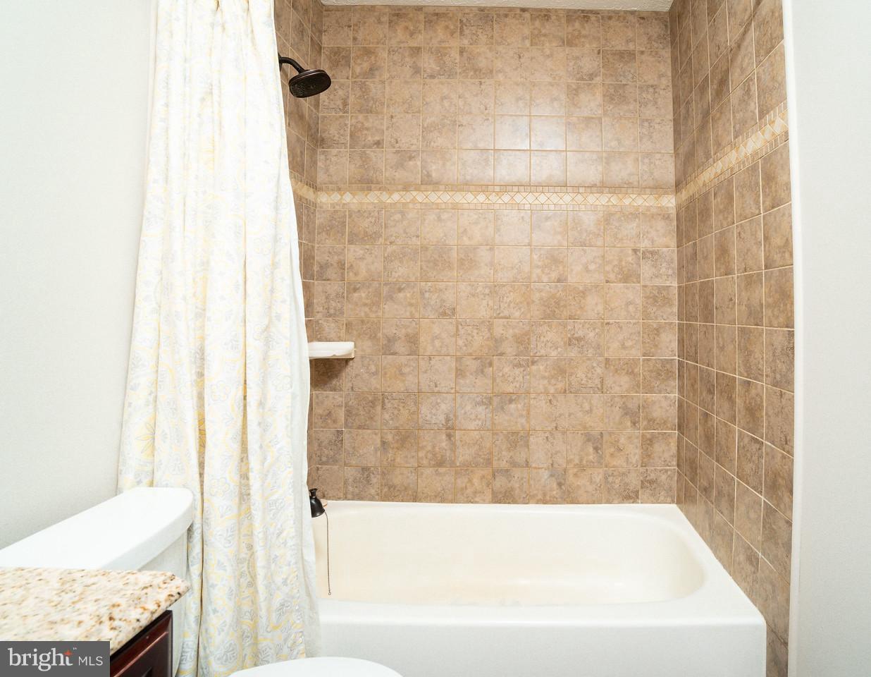 4083 Rustico Road Baltimore, MD 21220 - Photo 18 of 25 a bathroom with a bathtub