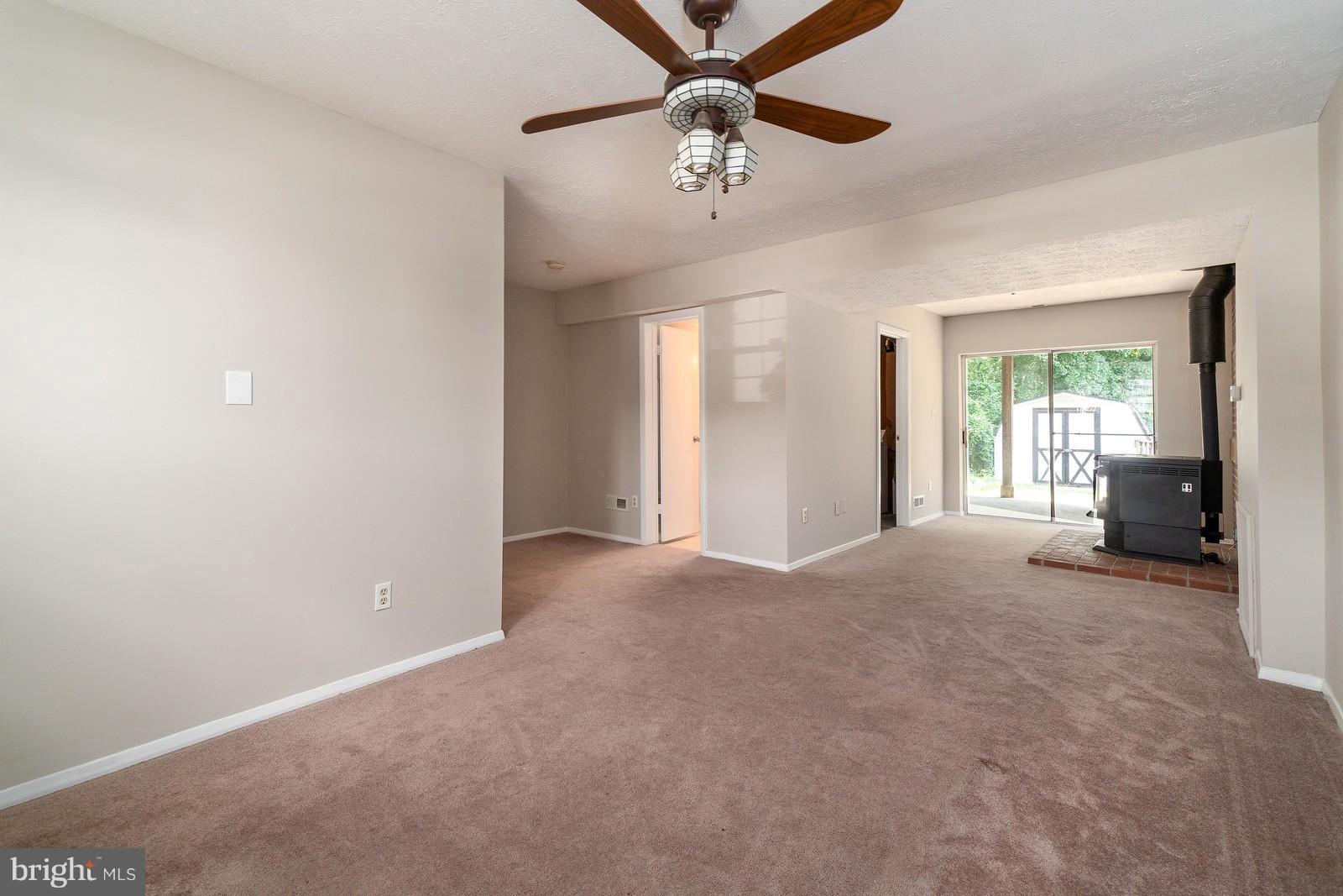 4083 Rustico Road Baltimore, MD 21220 - Photo 19 of 25 a view of a room with a ceiling fan and window
