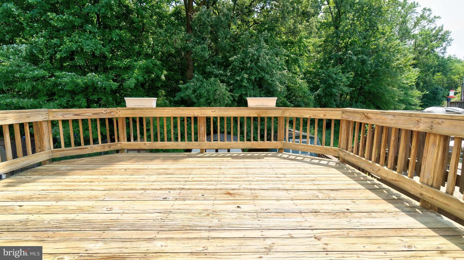 4083 Rustico Road Baltimore, MD 21220 - Photo 3 of 25 a view of balcony with wooden floor and fence