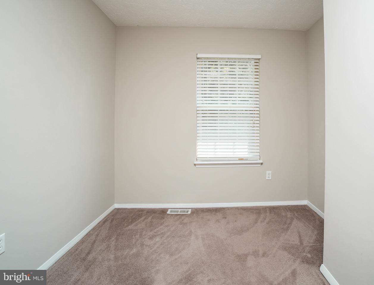 4083 Rustico Road Baltimore, MD 21220 - Photo 21 of 25 an empty room with a window