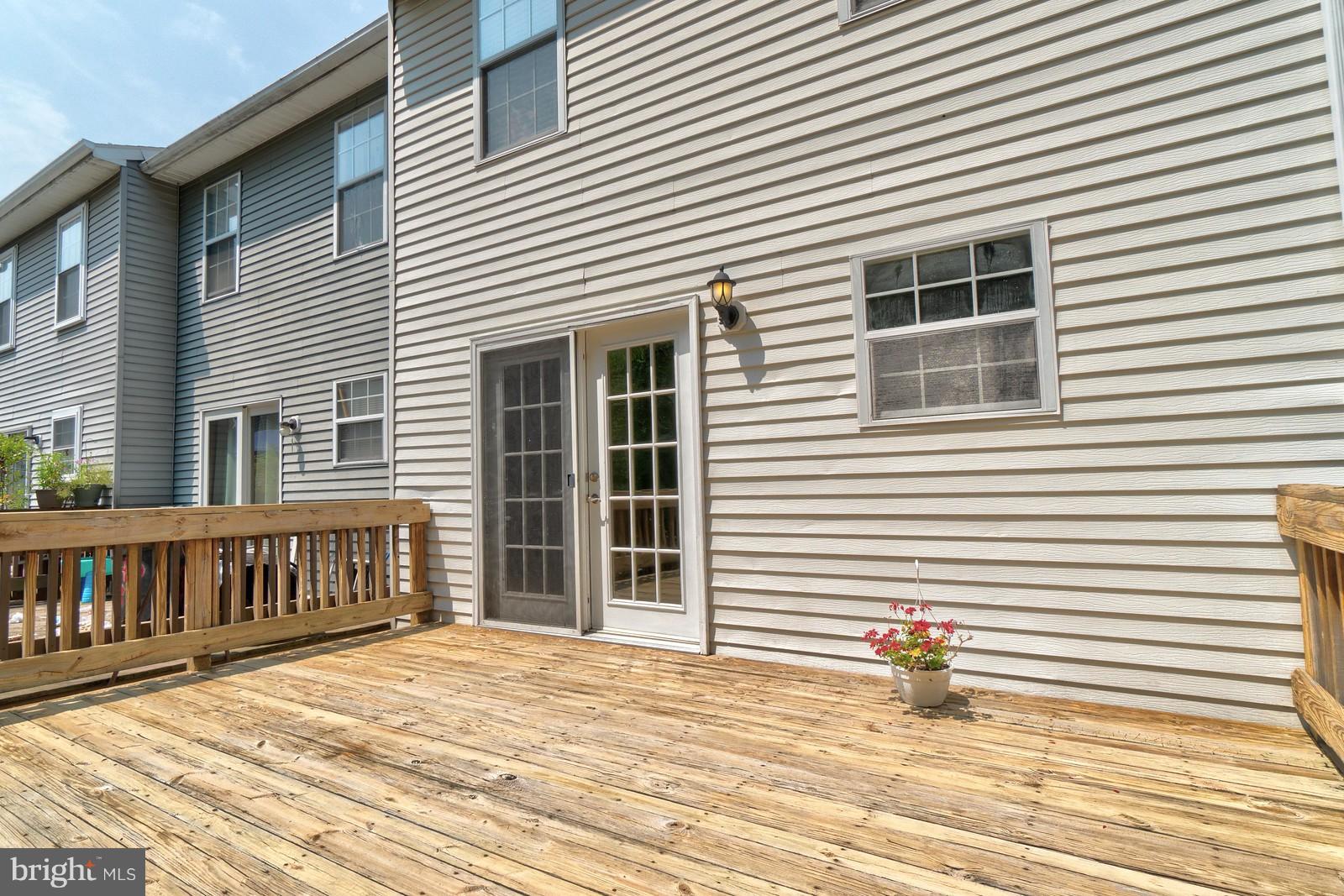 4083 Rustico Road Baltimore, MD 21220 - Photo 4 of 25 a view of a house with wooden deck
