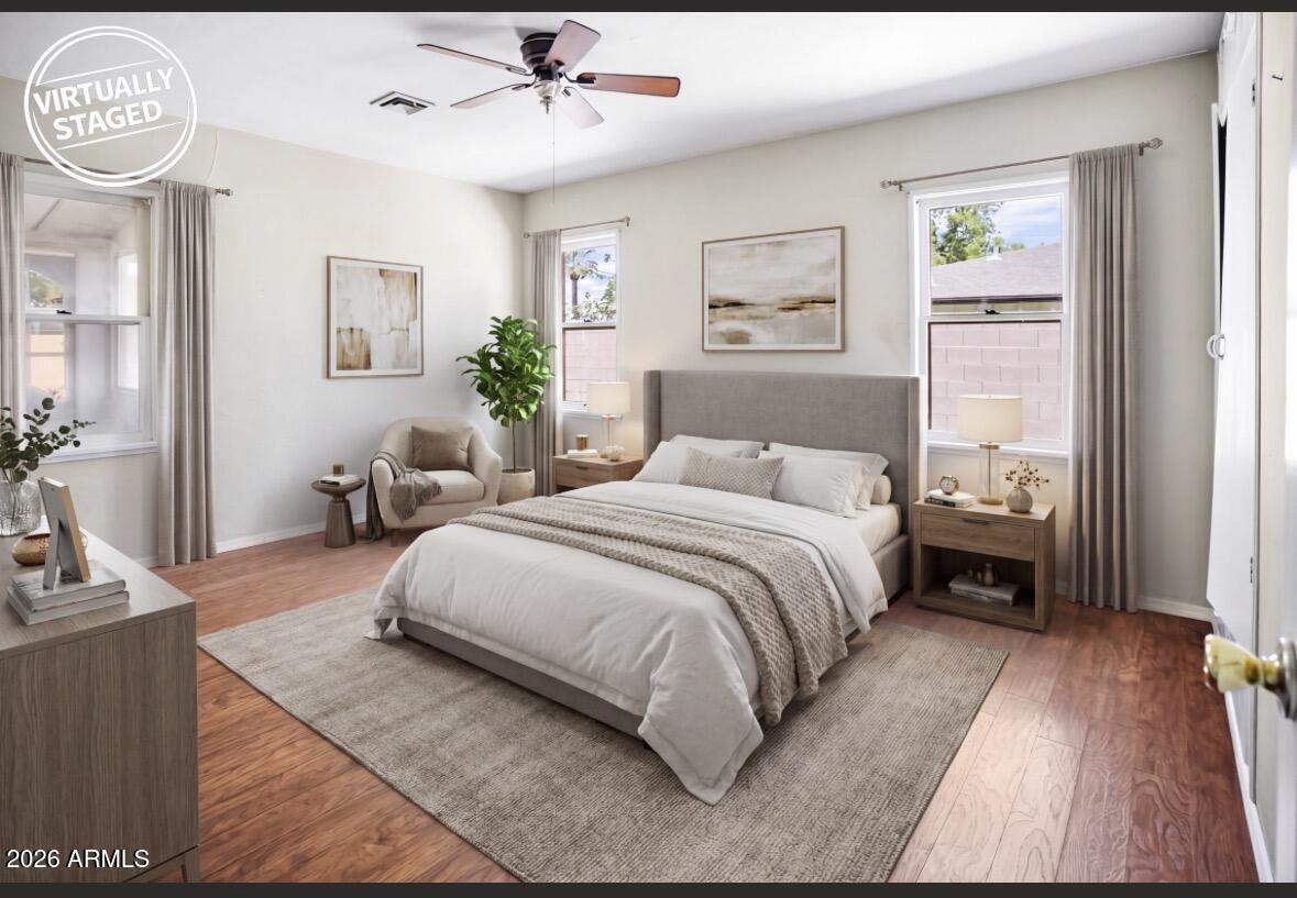 508 North Robson Mesa, AZ 85201 - Photo 4 of 19 a bedroom with a large bed and a chandelier