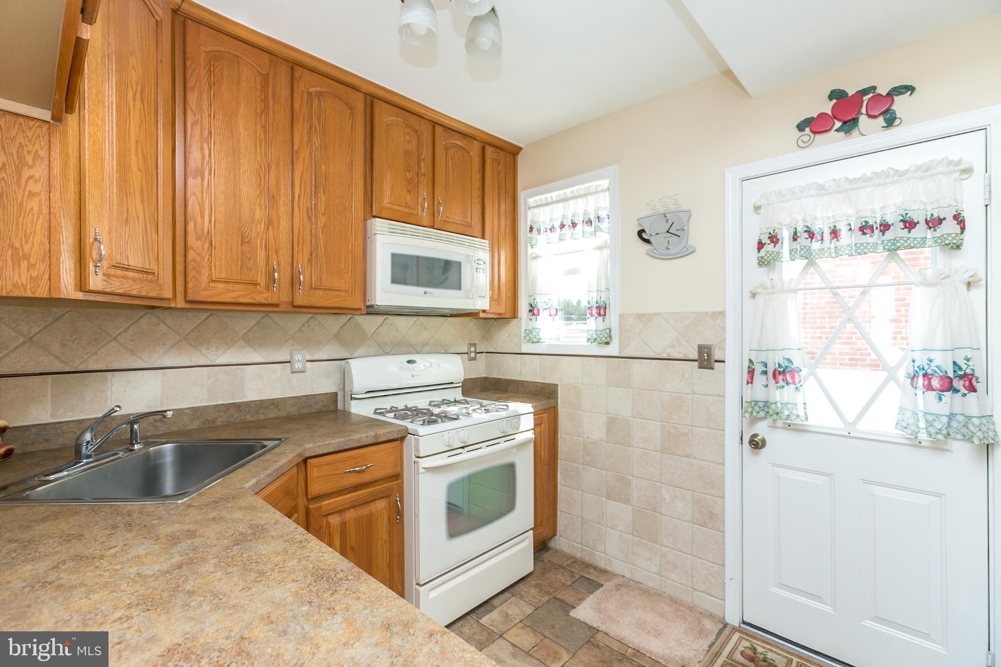 3003 Dunmurry Road Baltimore, MD 21222 - Photo 11 of 31 Solid Wood cabinetry in the kitchen