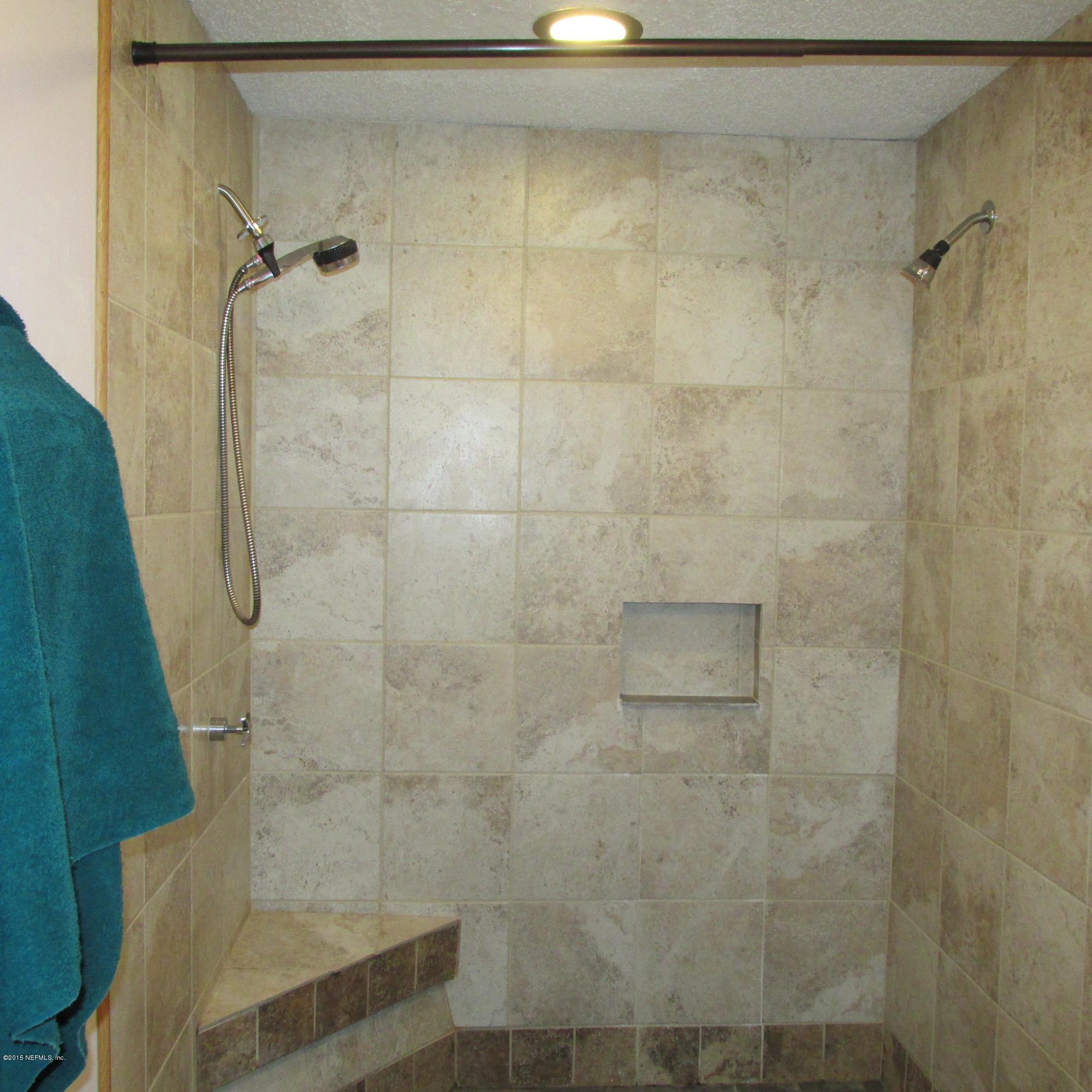 6841 Deer Springs Road Keystone Heights, FL 32656 - Photo 12 of 27 a bathroom with a shower