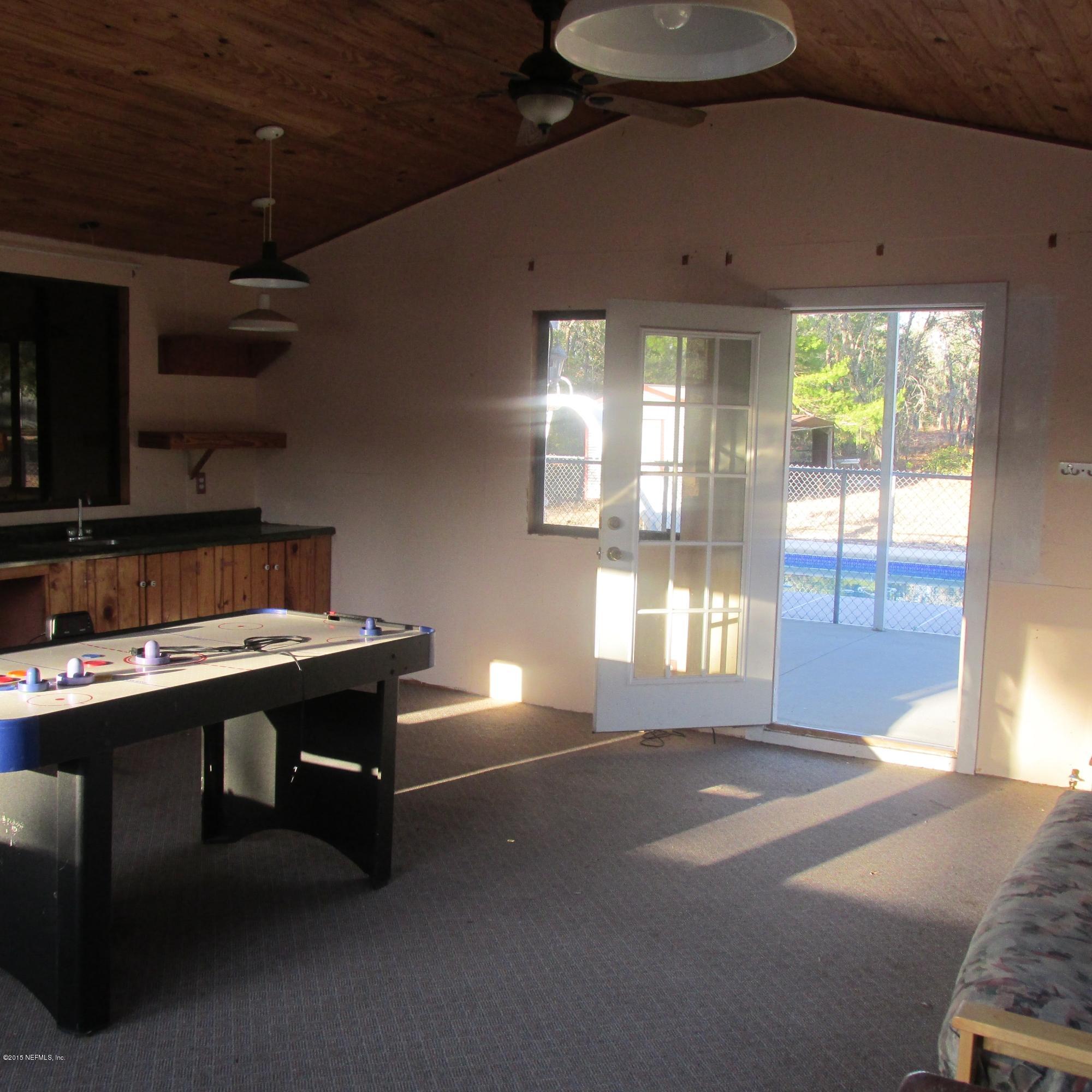 6841 Deer Springs Road Keystone Heights, FL 32656 - Photo 21 of 27 a room with furniture and window