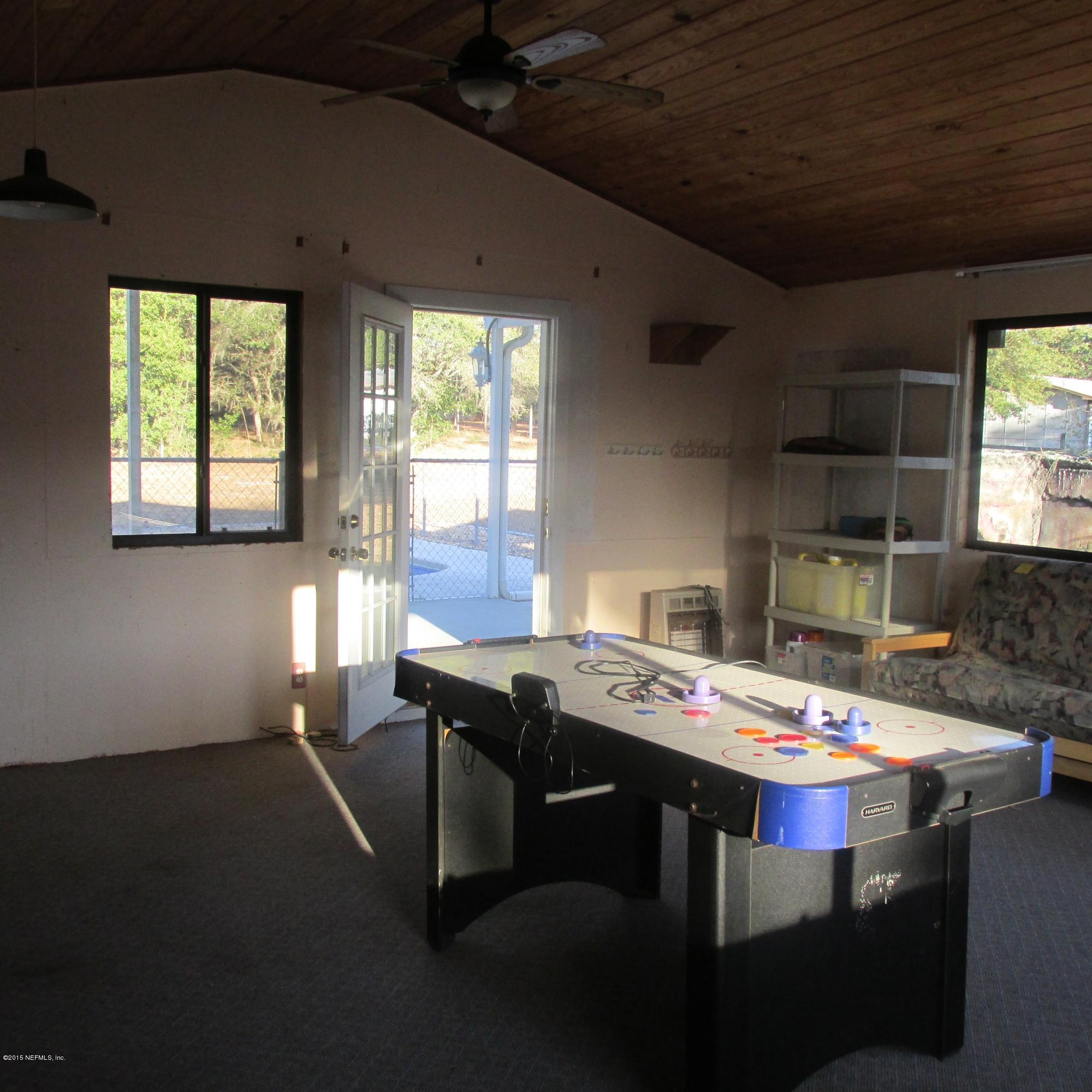 6841 Deer Springs Road Keystone Heights, FL 32656 - Photo 22 of 27 a view of a dining room with furniture window and outside view