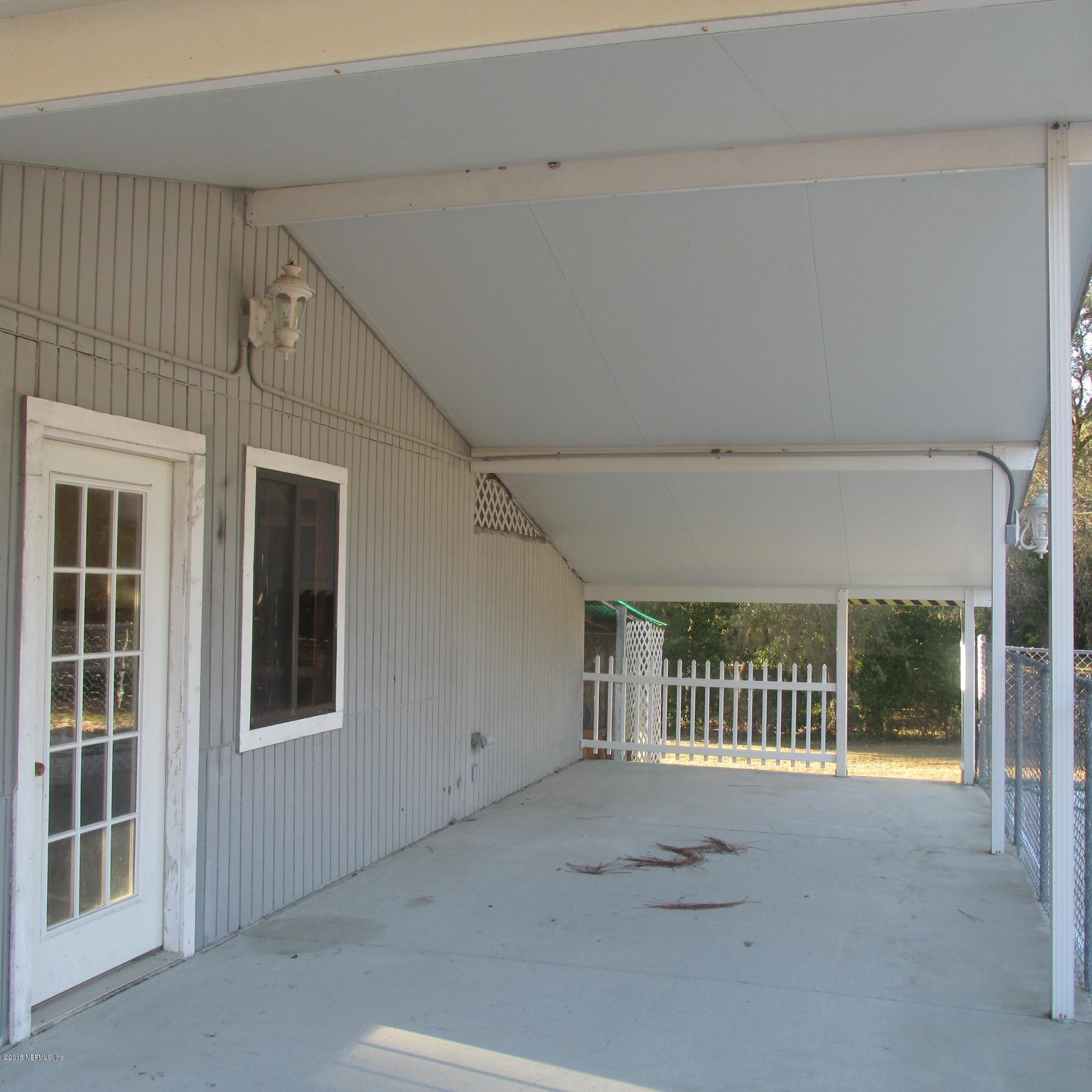 6841 Deer Springs Road Keystone Heights, FL 32656 - Photo 25 of 27 front view of a house with a large window