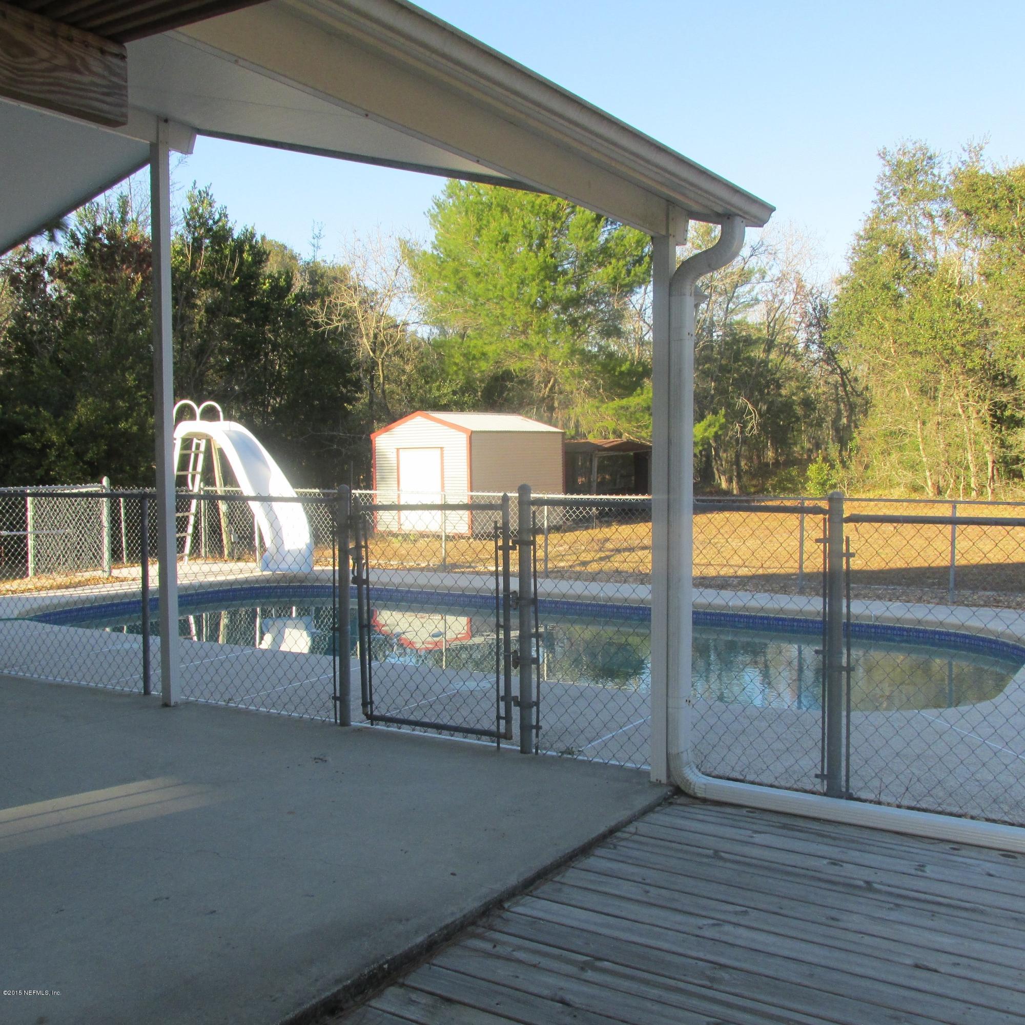 6841 Deer Springs Road Keystone Heights, FL 32656 - Photo 3 of 27 a view of with deck and a backyard