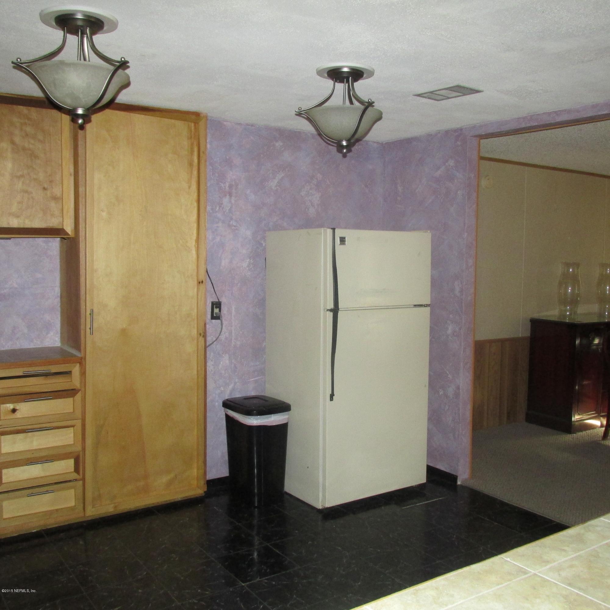 6841 Deer Springs Road Keystone Heights, FL 32656 - Photo 8 of 27 a view of a storage & utility room with a window