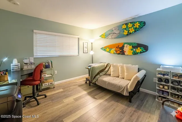 a work room with furniture and wooden floor