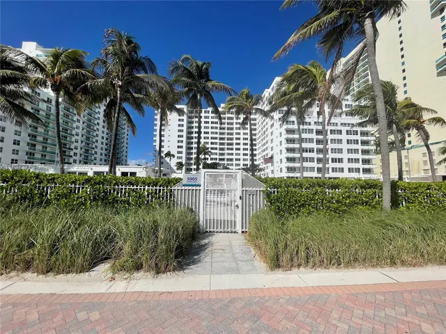 a view of a street with a building in the background