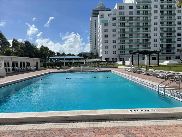 a view of a terrace with chairs and potted plants