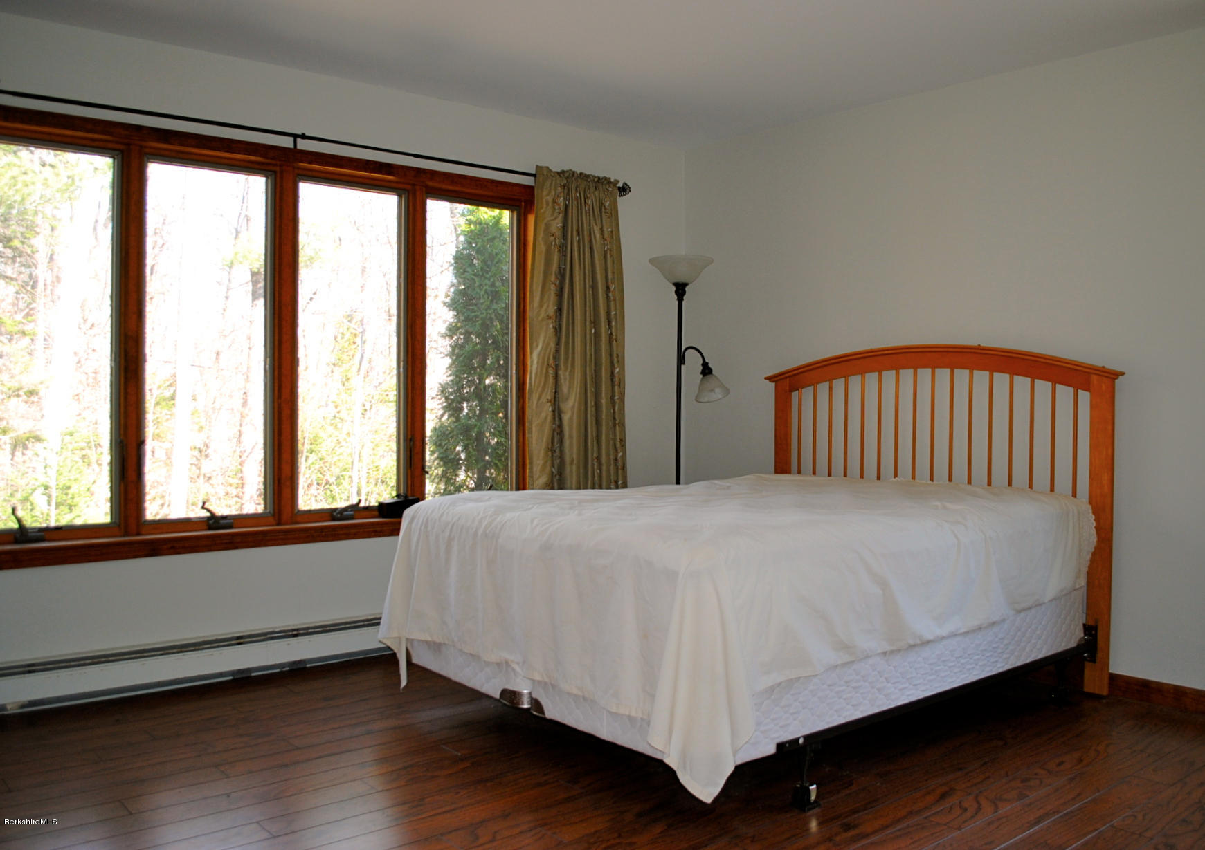 919 Fred Snow Road Becket, MA 01223 - Photo 11 of 23 a bedroom with a bed and wooden floor